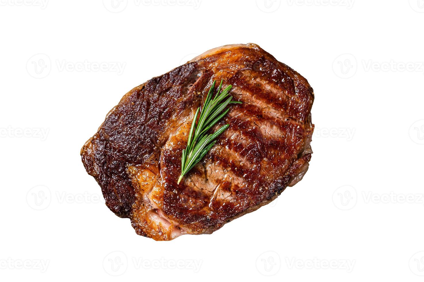 Roasted rib eye steak, ribeye beef meat in a grill pan. Isolated on white background. photo