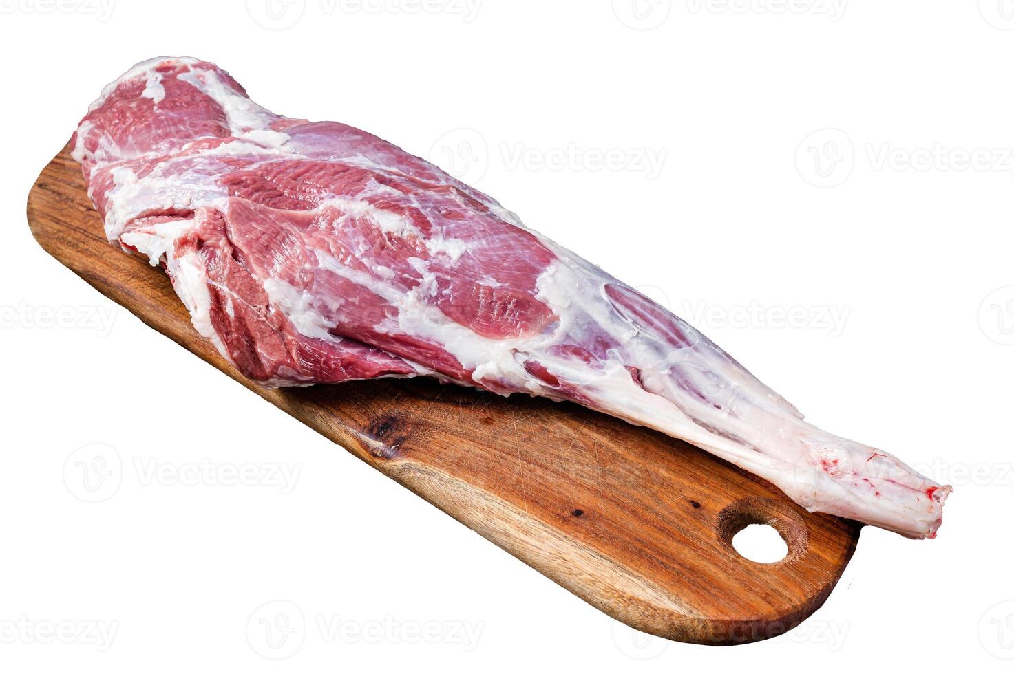 Mutton meat. Raw whole lamb leg thigh on butcher board. Isolated, white background. photo