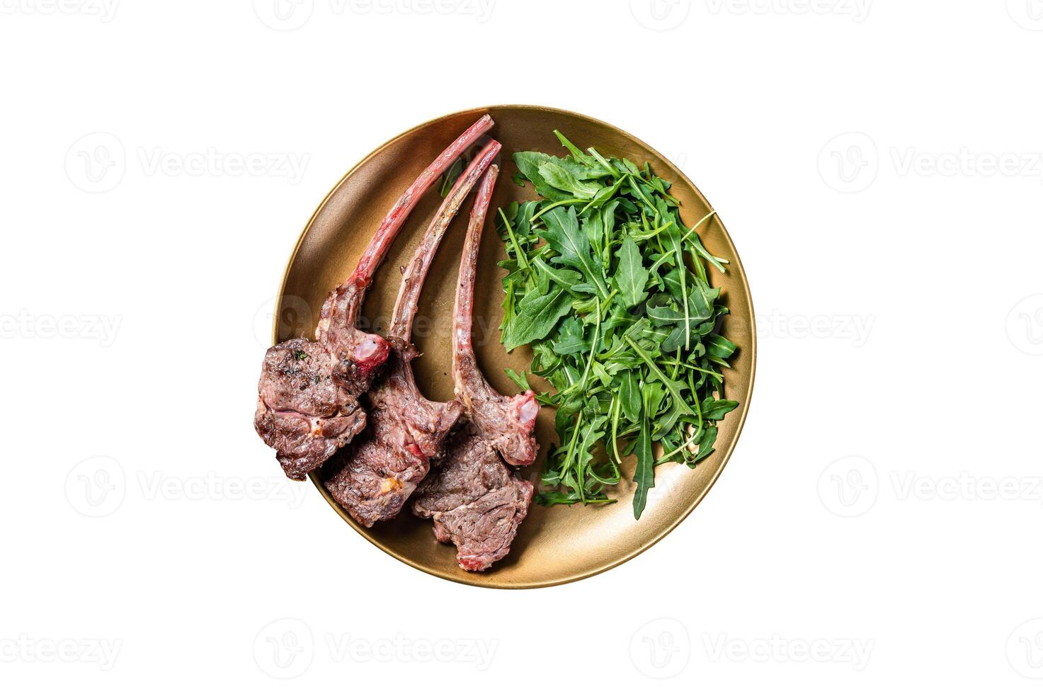 BBQ grilled lamb cutlet or mutton chop steak with arugula salad on a plate. Isolated on white background. photo