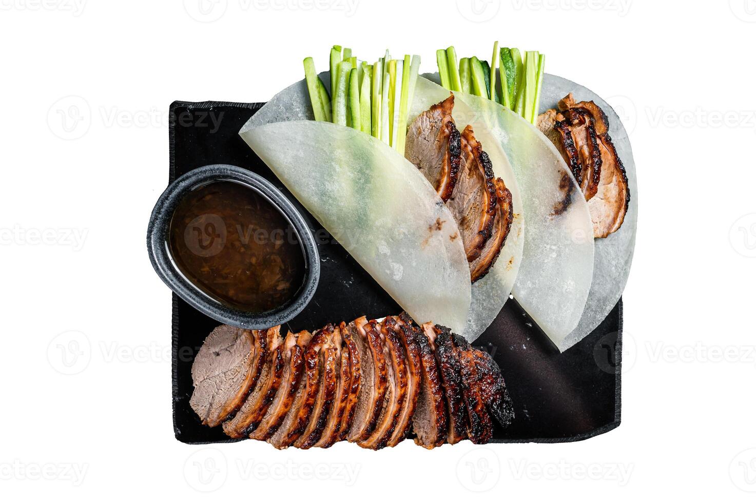 Traditional served Peking Duck with cucumber, green onion, in wheaten chinese pancakes. Isolated on white background. photo