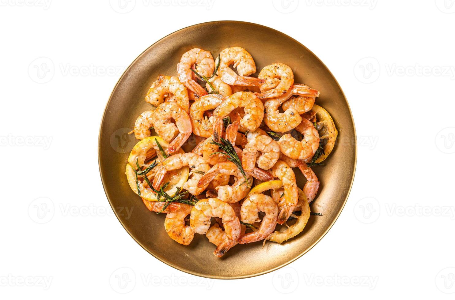 Spicy garlic chilli Prawns Shrimps with lemon and rosemary on a plate. Isolated on white background. photo