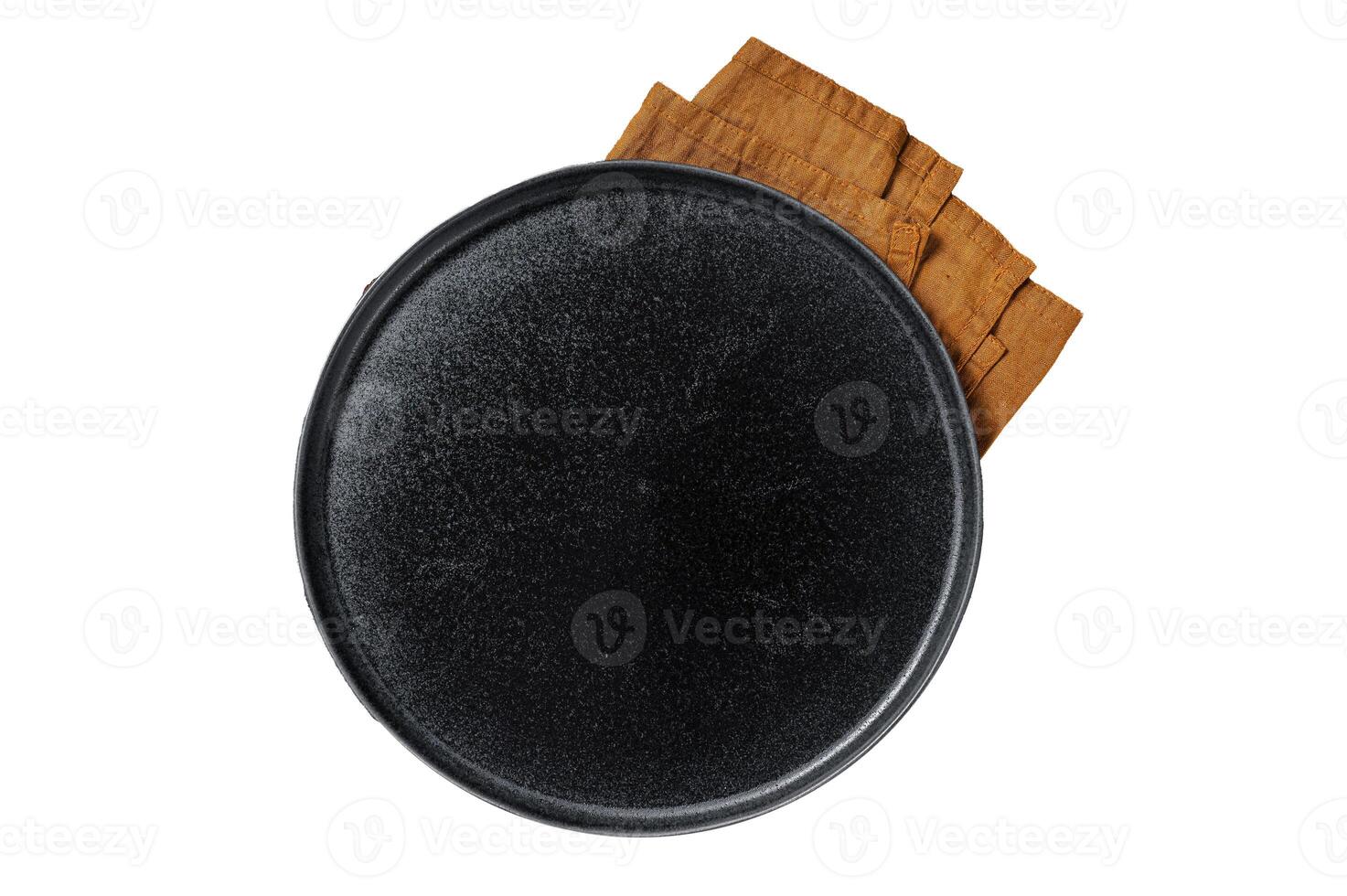 Table setting with vintage empty black plate on rustic wood. Isolated, white background. photo