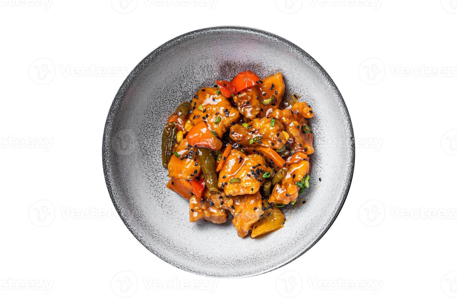 Chinese Sweet and Sour Pork guo bao rou in a bowl. Isolated on white background. photo