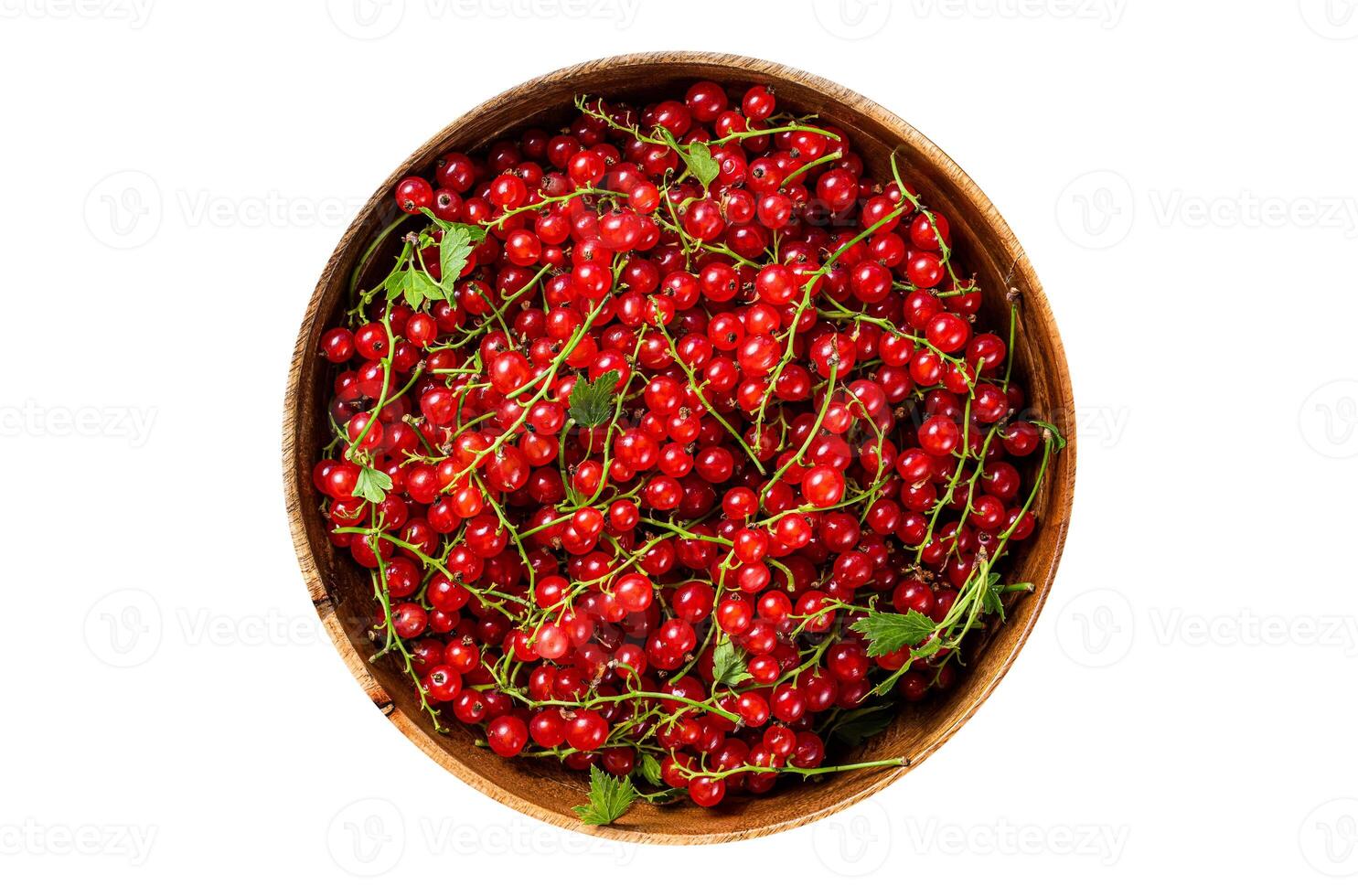 Ripe Red currant berries in a wooden plate. Isolated, white background. Top view. photo