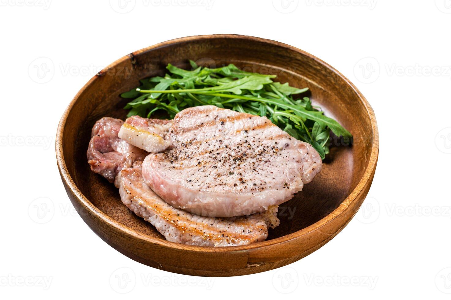 Roasted pork chop steaks or cutlets with arugula salad. Isolated on white background. Top view. photo