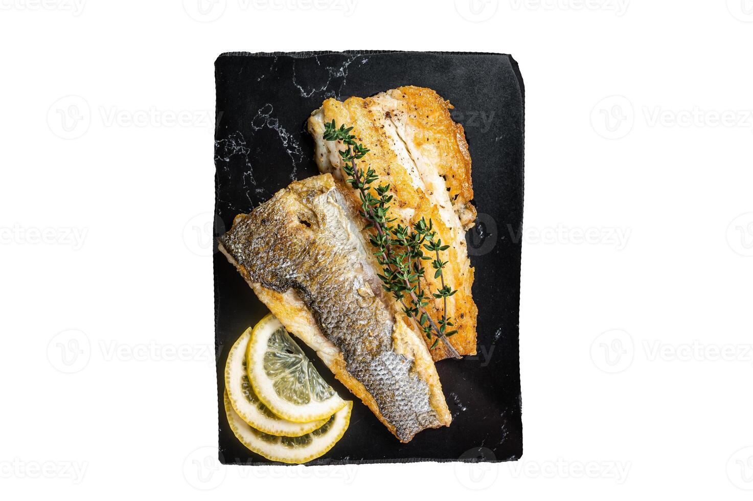 Roast sea bass fillet with lemon and thyme, seabass fish. Isolated, white background. photo