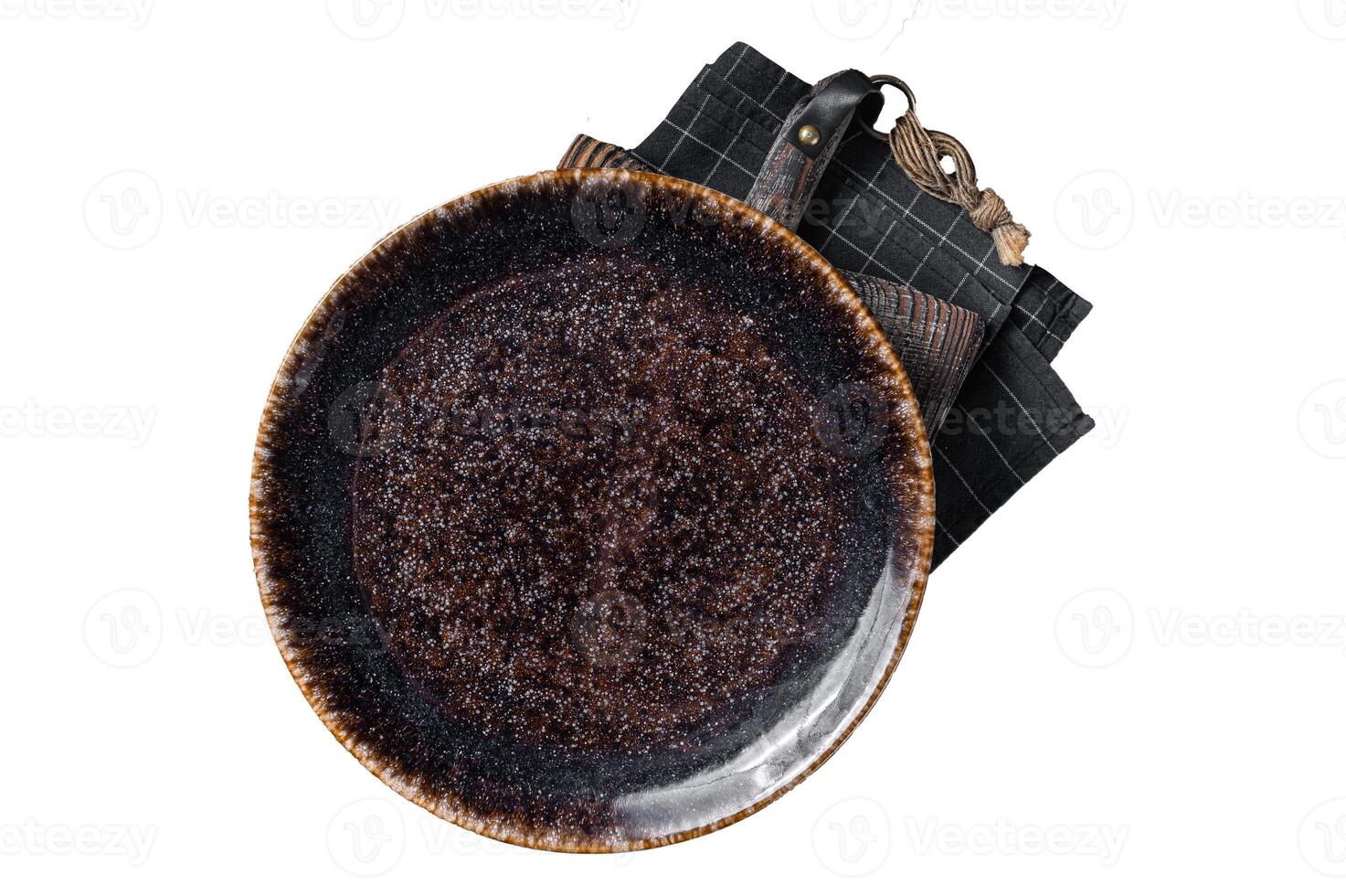 Table setting with vintage empty black plate on rustic wood. Isolated, white background. photo