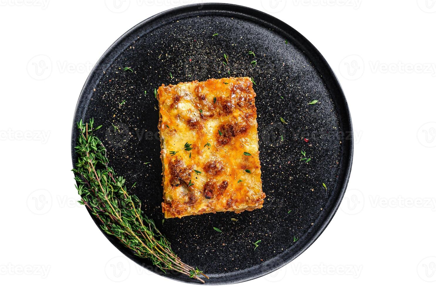 Lasagna with mince beef meat and tomato bolognese sauce on a plate. Isolated on white background. photo
