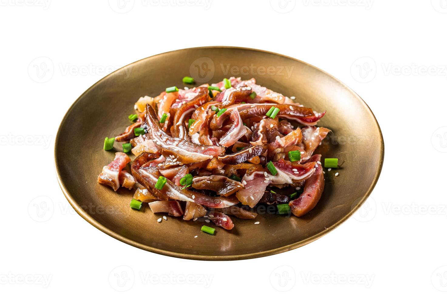 Asian appetizer pig pork ears with sesame seeds, green onion and spicy sauce. Isolated on white background. Top view. photo