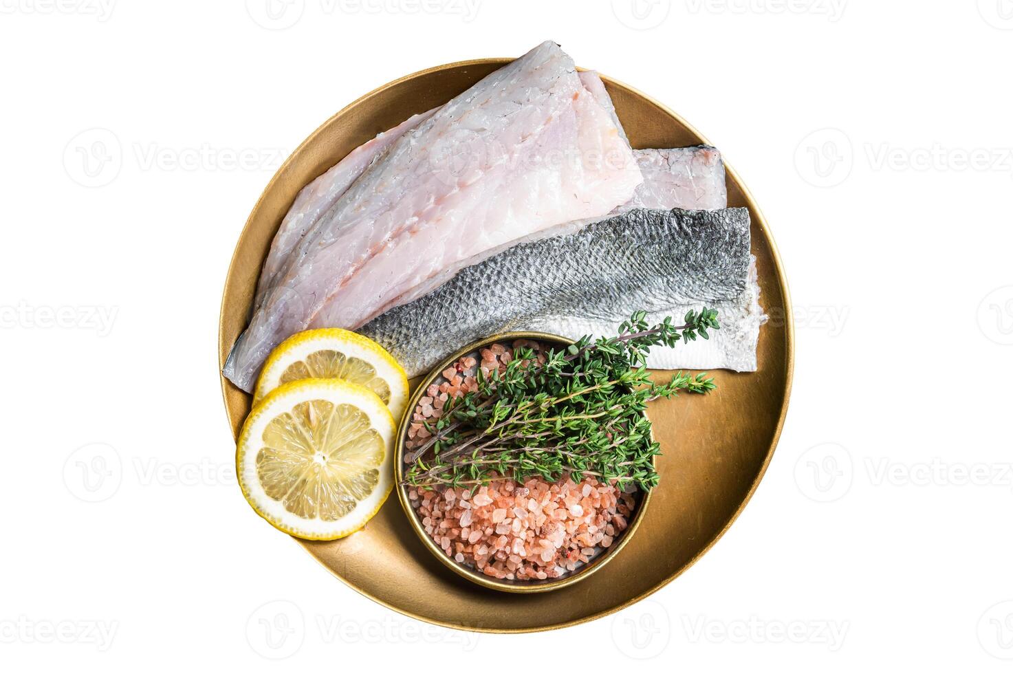Uncooked Raw Sea Bass fillets, Seabass fish with thyme, pink salt and lemon. Isolated on white background. photo