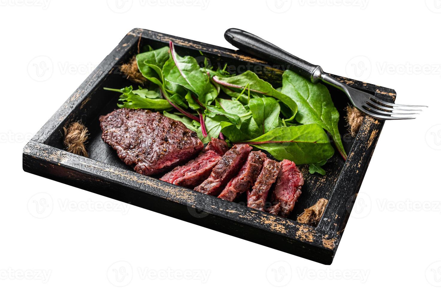 BBQ roasted flank steak in wooden tray with vegetable salad. Isolated on white background. Top view. photo