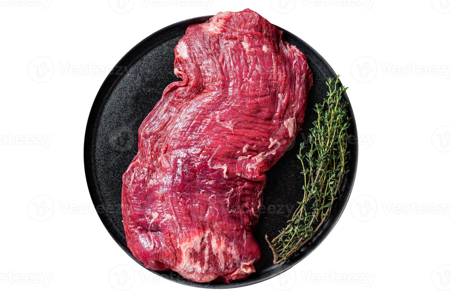 Flank or flap raw beef steak on plate with thyme. Isolated, white background. Top view. photo