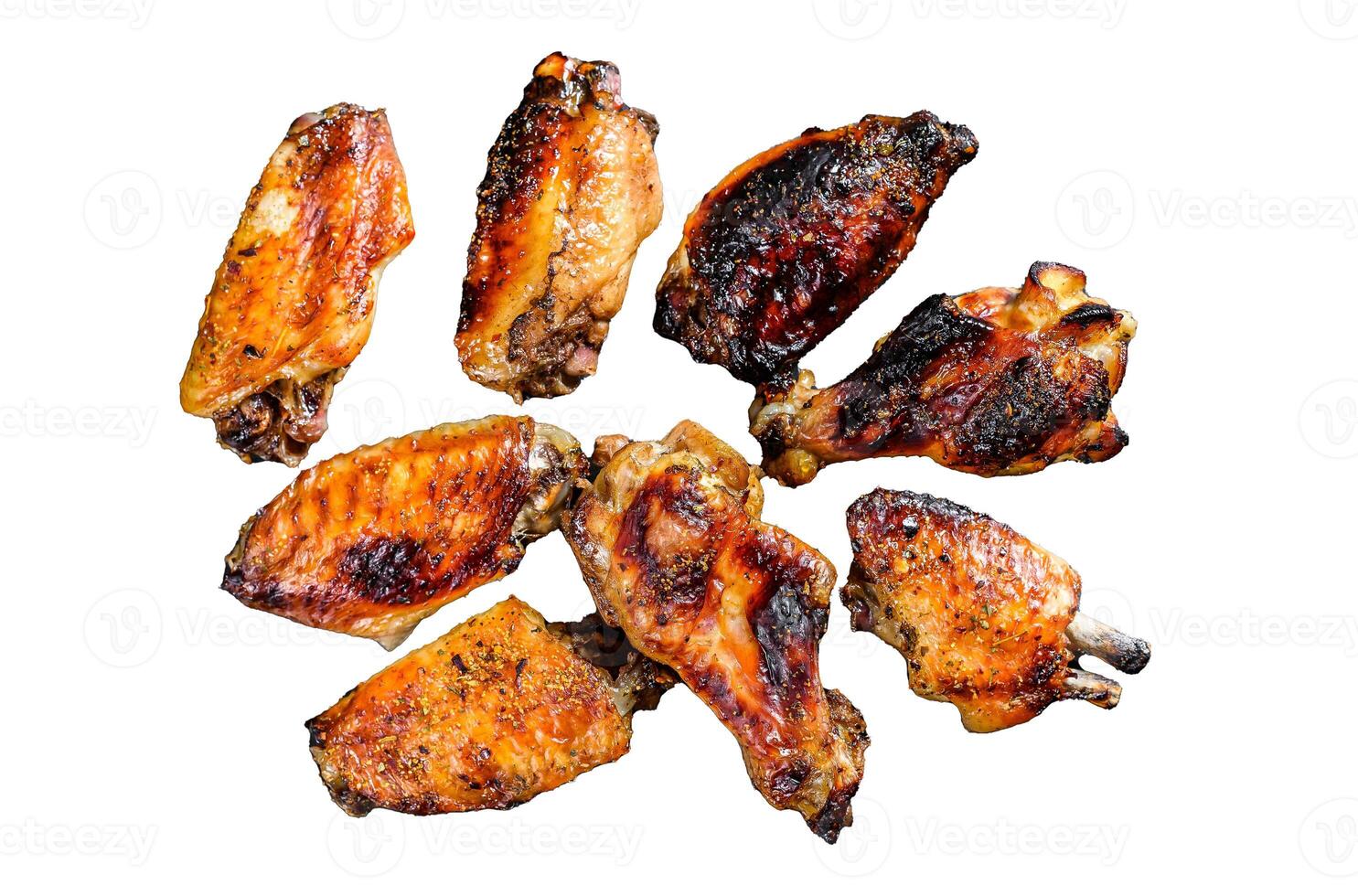 Hot and spicy chicken wings with hot sauce. Isolated on white background. Top view. photo
