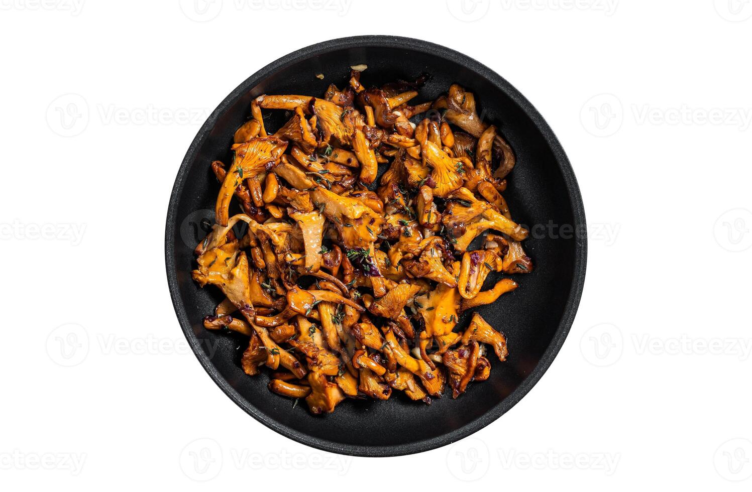 Fried chanterelle mushrooms with onions and thyme in a skillet. Isolated, white background. Top view. photo