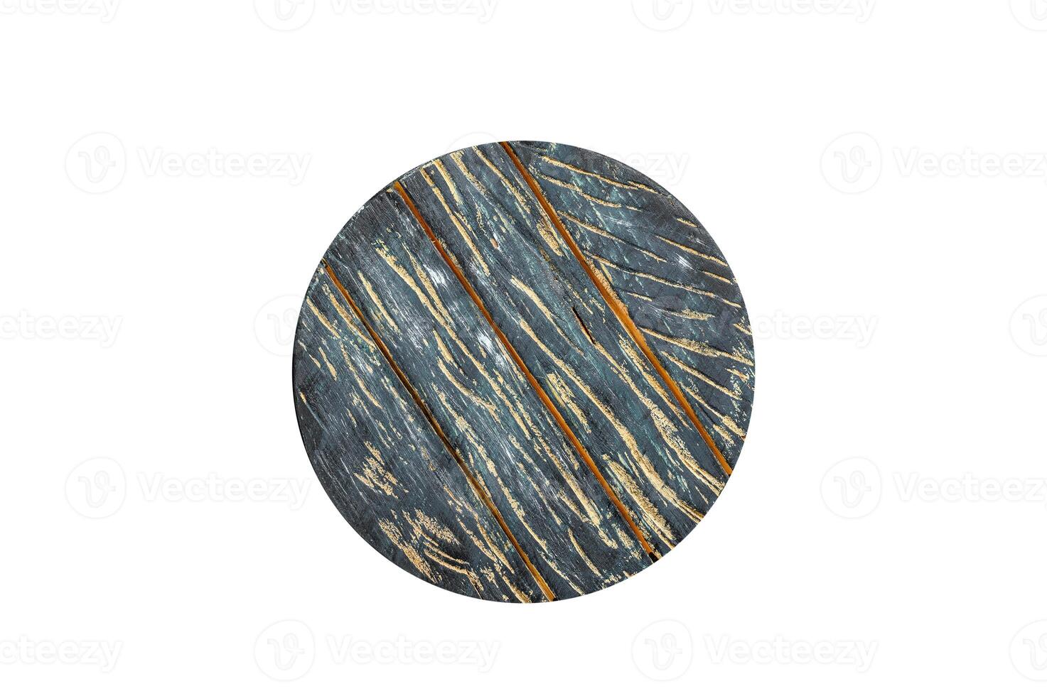 Old dark cutting board on brown wooden table. Isolated, white background. photo