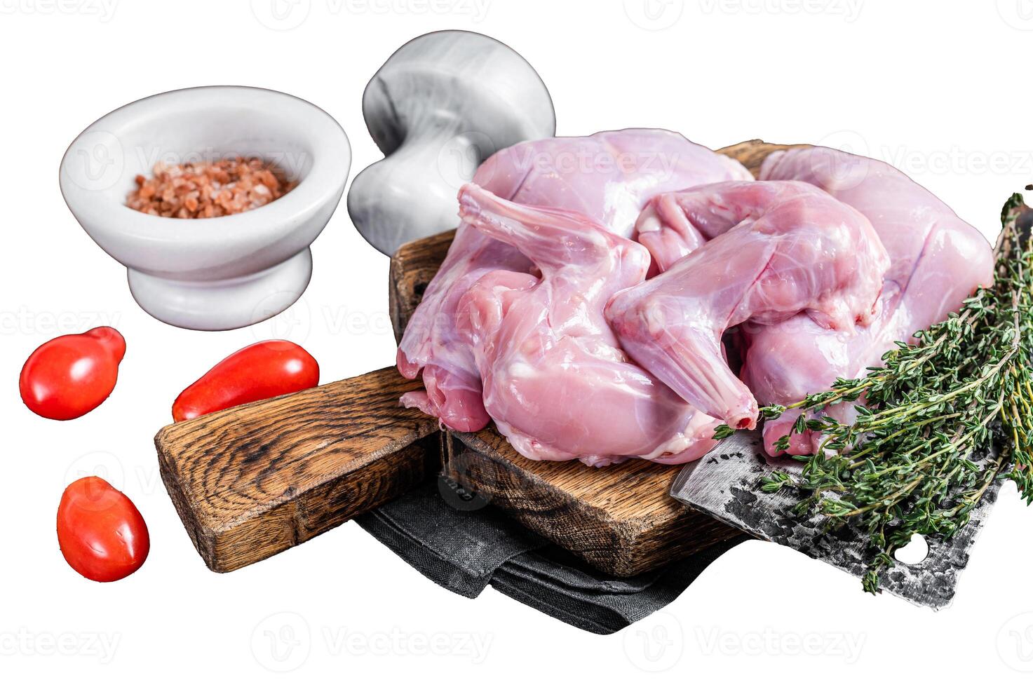 Raw hare legs on a butcher board with thyme. Isolated on white background, top view. photo