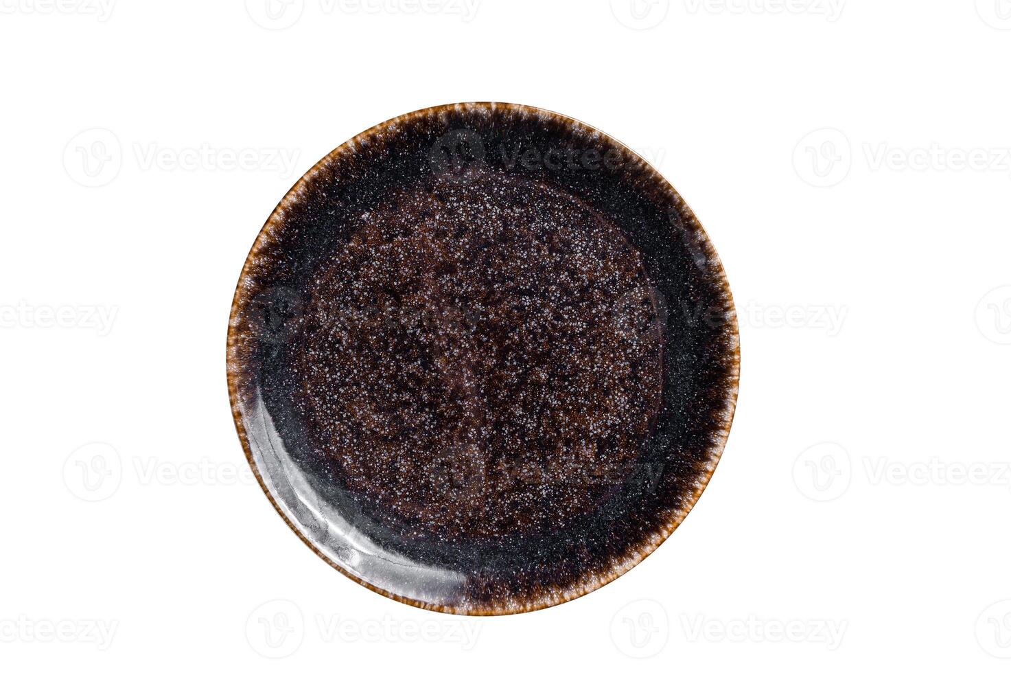 Table setting with vintage empty black plate on rustic wood. Isolated on white background. photo