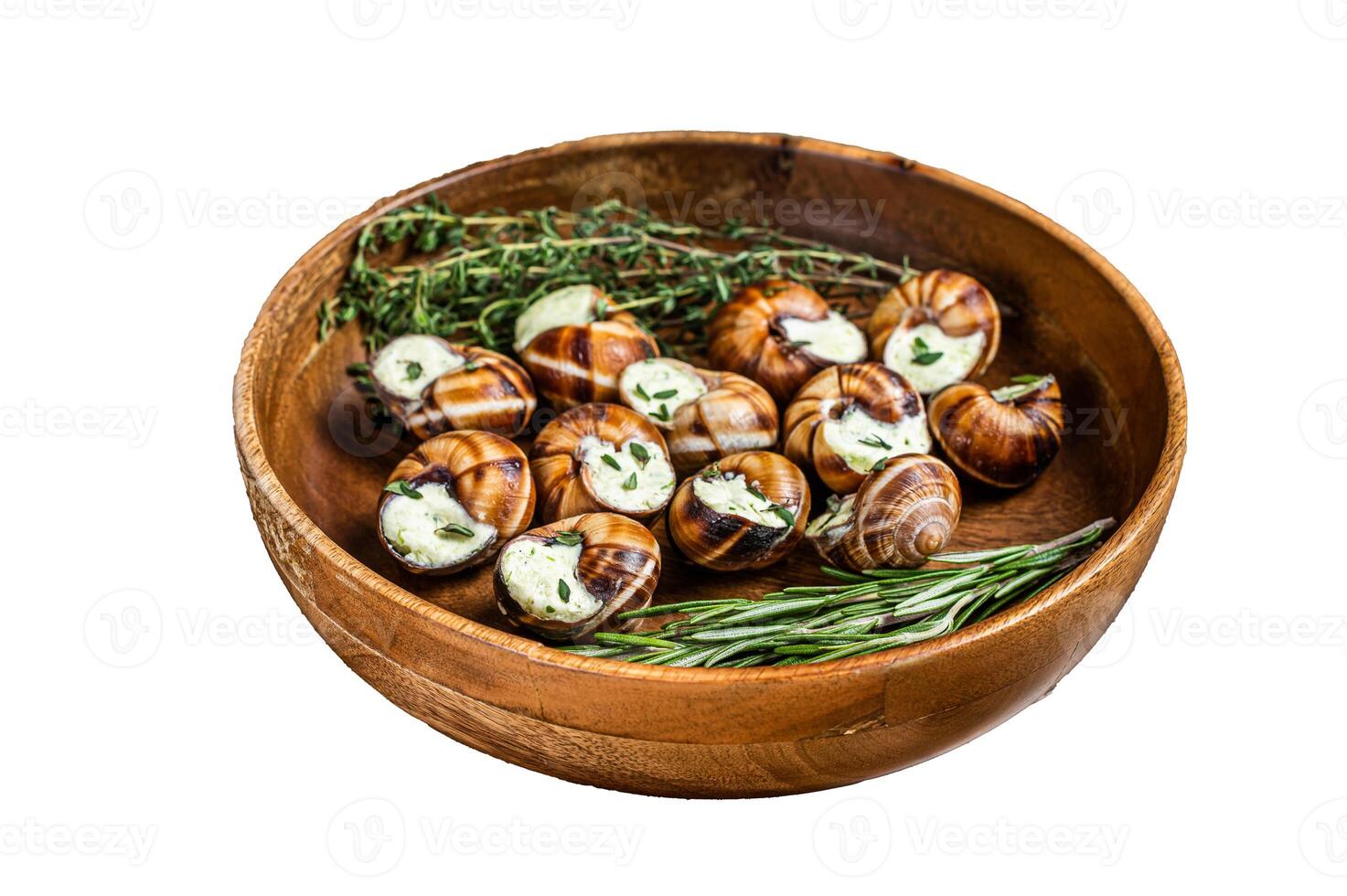 French Escargot Snails with garlic butter in a wooden plate. Isolated on white background, top view. photo