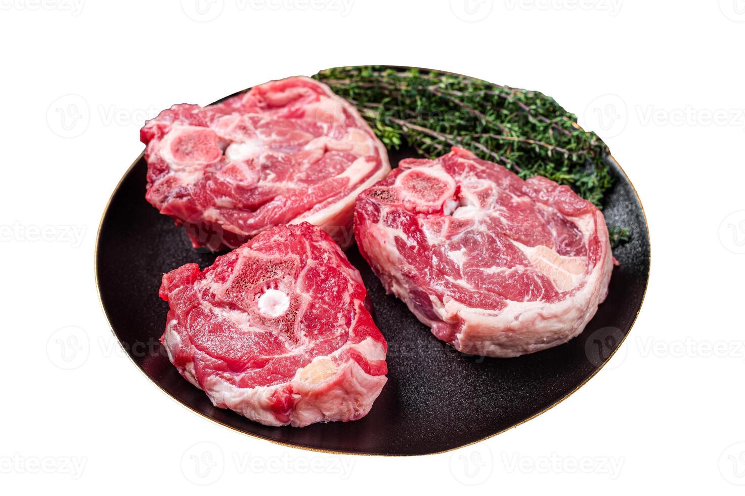 Raw Lamb Gerdan, lamb neck chops on a plate with herbs Isolated on white background. Top view. photo