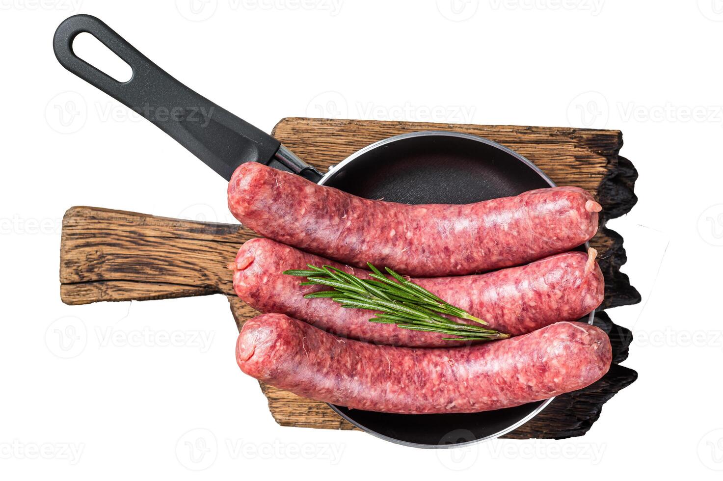 Raw sausages ready for cooking in a skillet, uncooked meat. Isolated, white background. photo