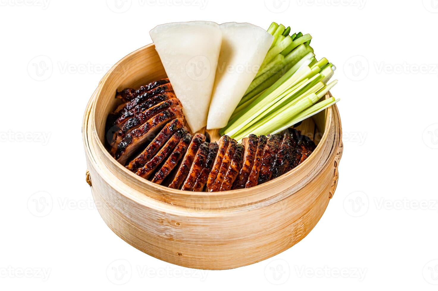 Peking Duck in bamboo steamer served with cucumber, green onion, and wheaten chinese pancakes. Isolated on white background. Top view. photo