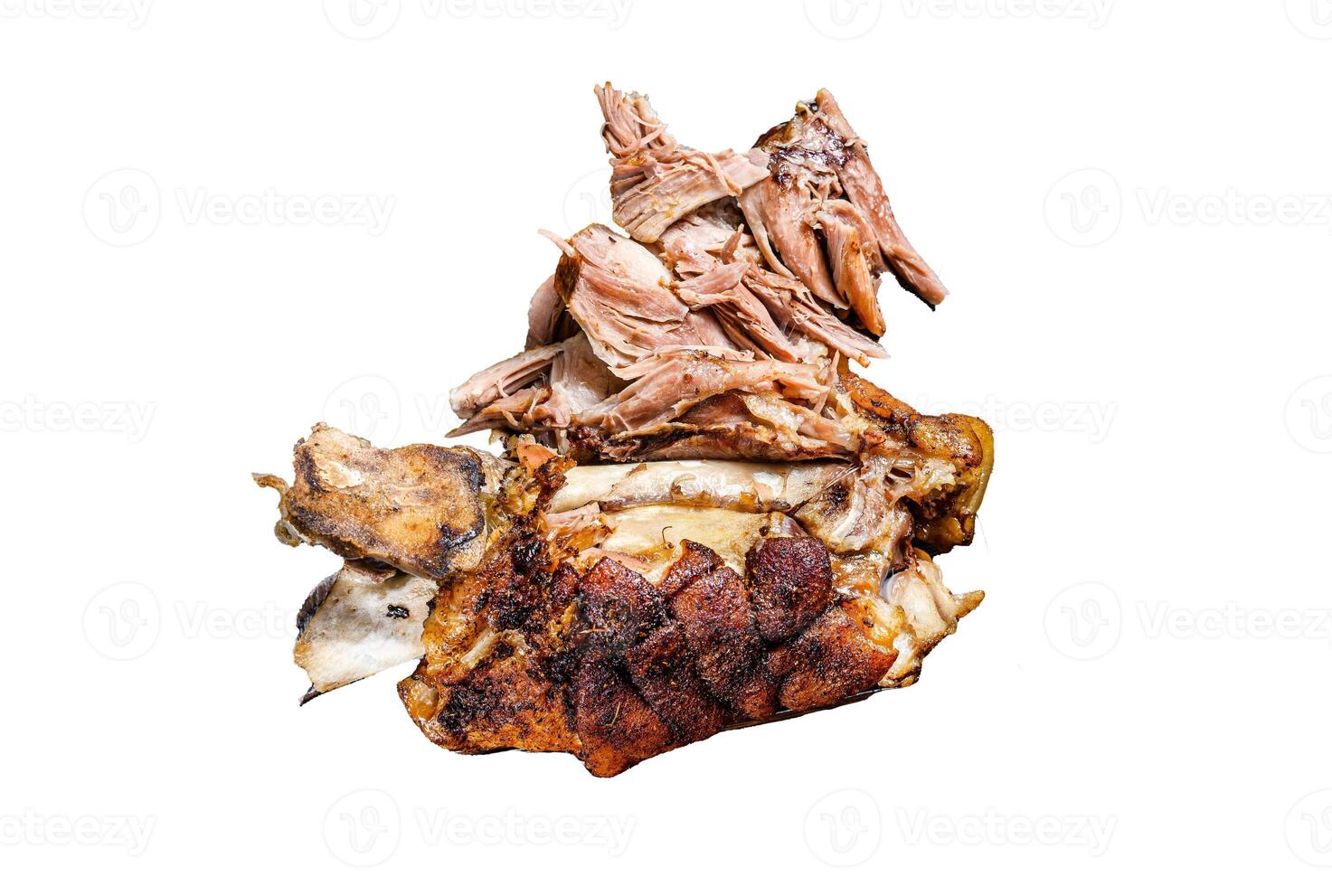 Roasted and cut German pork knuckle eisbein meat on a wooden board with meat cleaver. Isolated on white background. photo