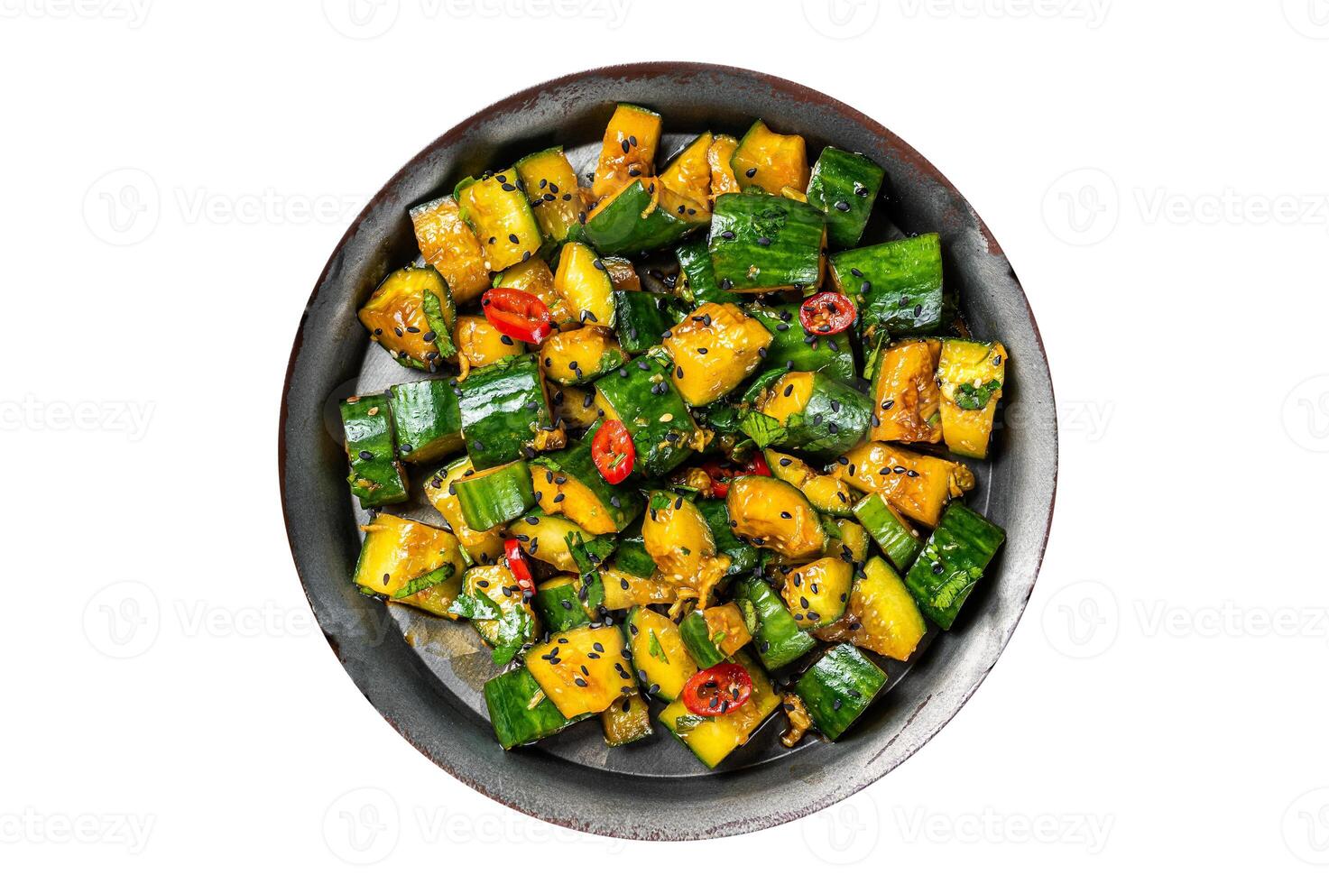 Chinese smashed cucumber salad with chili peppers and sesame seeds. Isolated on white background. photo
