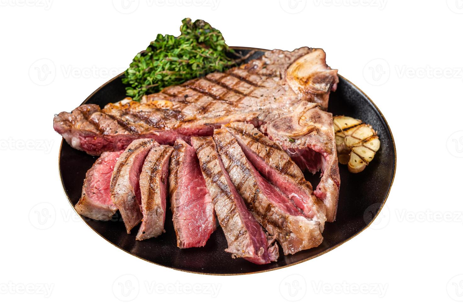 Grilled Medium rare Porterhouse, T-Bone Steak sliced in a plate. Isolated on white background. photo