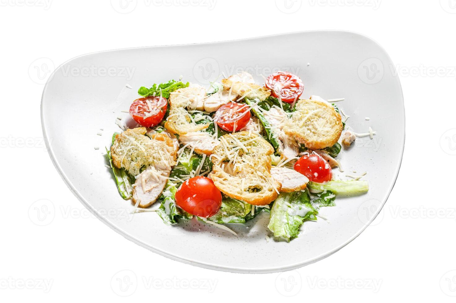 Caesar salad with grilled chicken, croutons, quail eggs and cherry tomatoes. Isolated on white background. Top view. photo