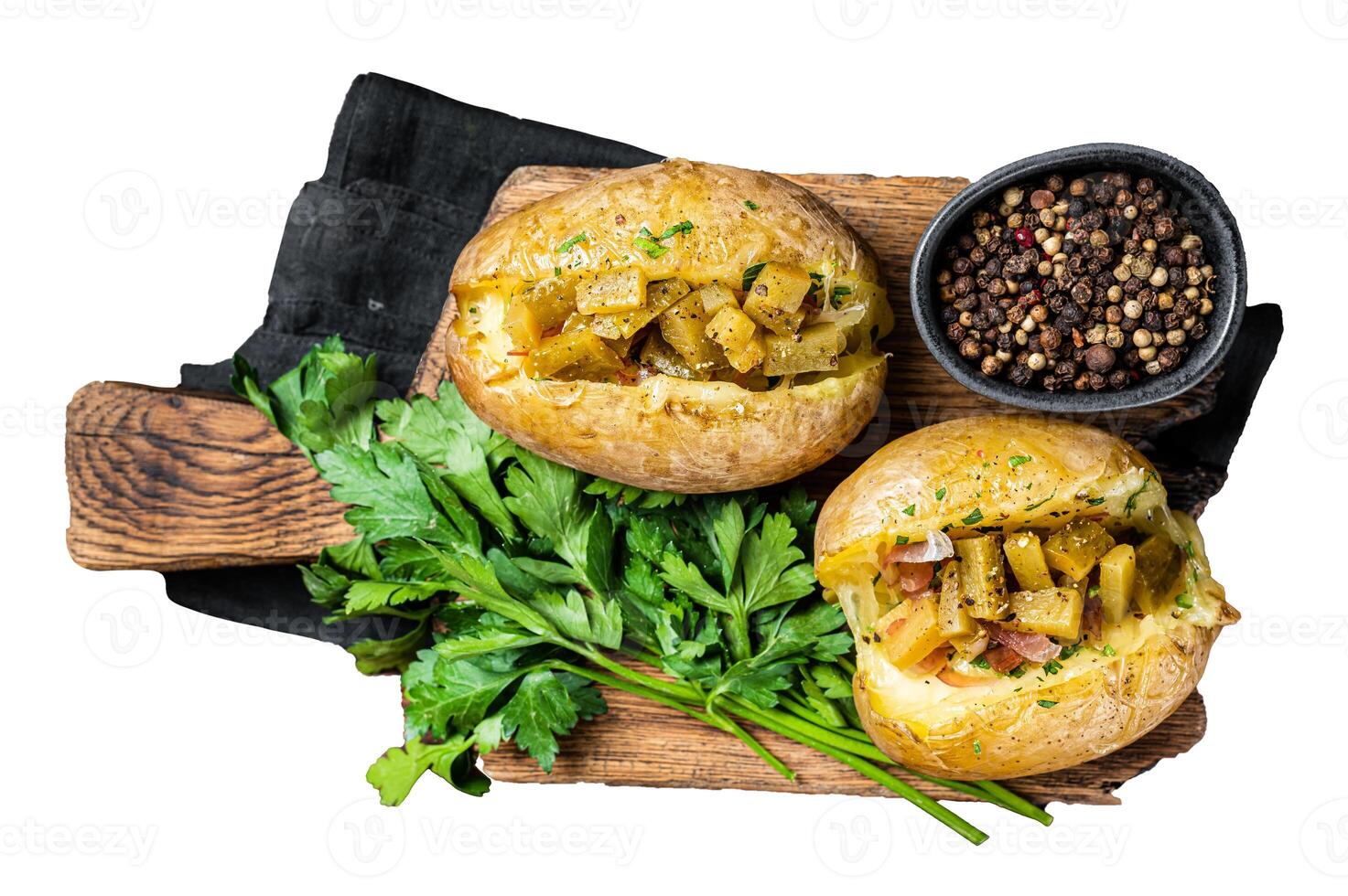 Kumpir, baked Jacket potatoes stuffed with cheese, bacon, salty cucumber, herbs and butter. Isolated, white background. photo