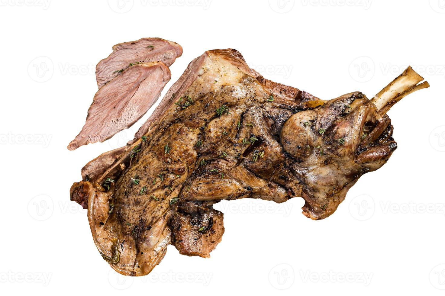 Baked whole lamb shoulder leg with herbs and spices in a steel plate. Isolated on white background photo
