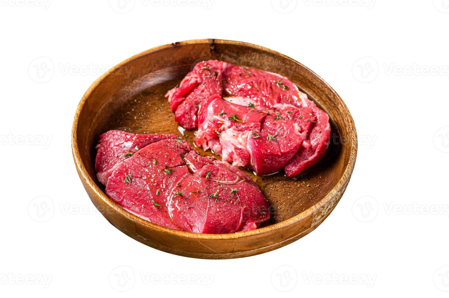 Fresh Mutton chop leg steaks, uncooked lamb meat with herbs. Isolated on white background. Top view. photo