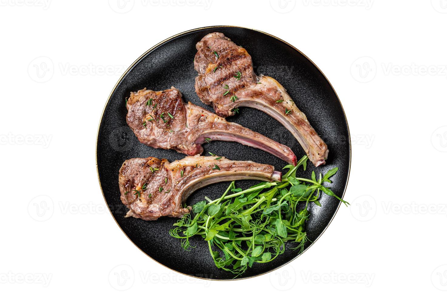 Roasted lamb meat cutlets, mutton chops with garnish. Isolated on white background. photo