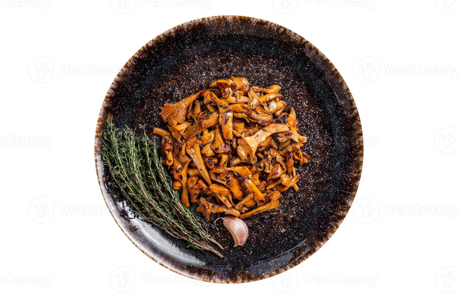 Cooked wild fried chanterelle mushrooms with onions and herbs. Isolated, white background. Top view. photo