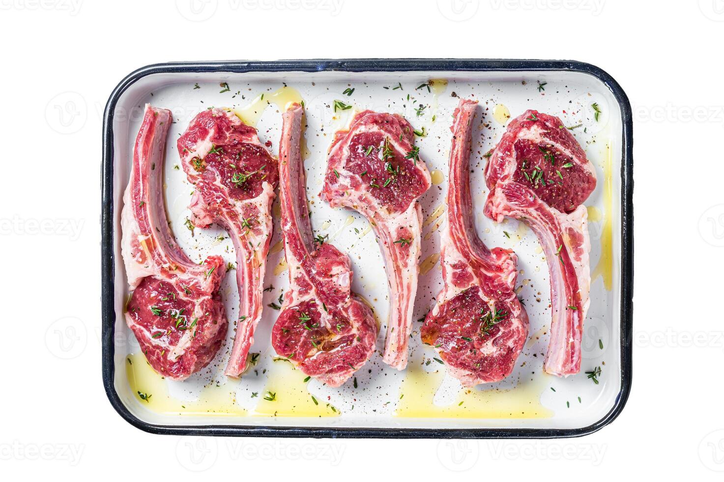 Ready for cooking raw lamb chop steaks with spices and herbs. Isolated, white background. photo