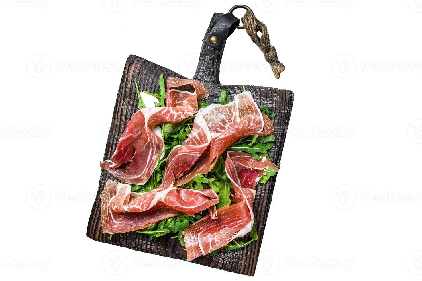 Sliced Spanish Jamon Serrano ham or Prosciutto Crudo Parma ham. Isolated on white background, Top view. photo