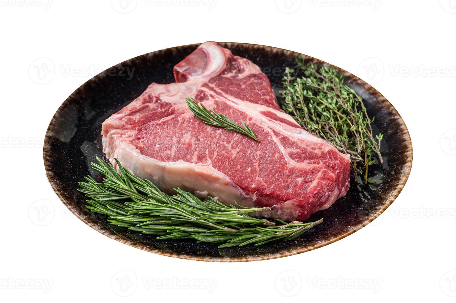 Dry aged Raw porterhouse beef meat Steak, fresh T bone on rustic plate with spices. Isolated on white background. photo