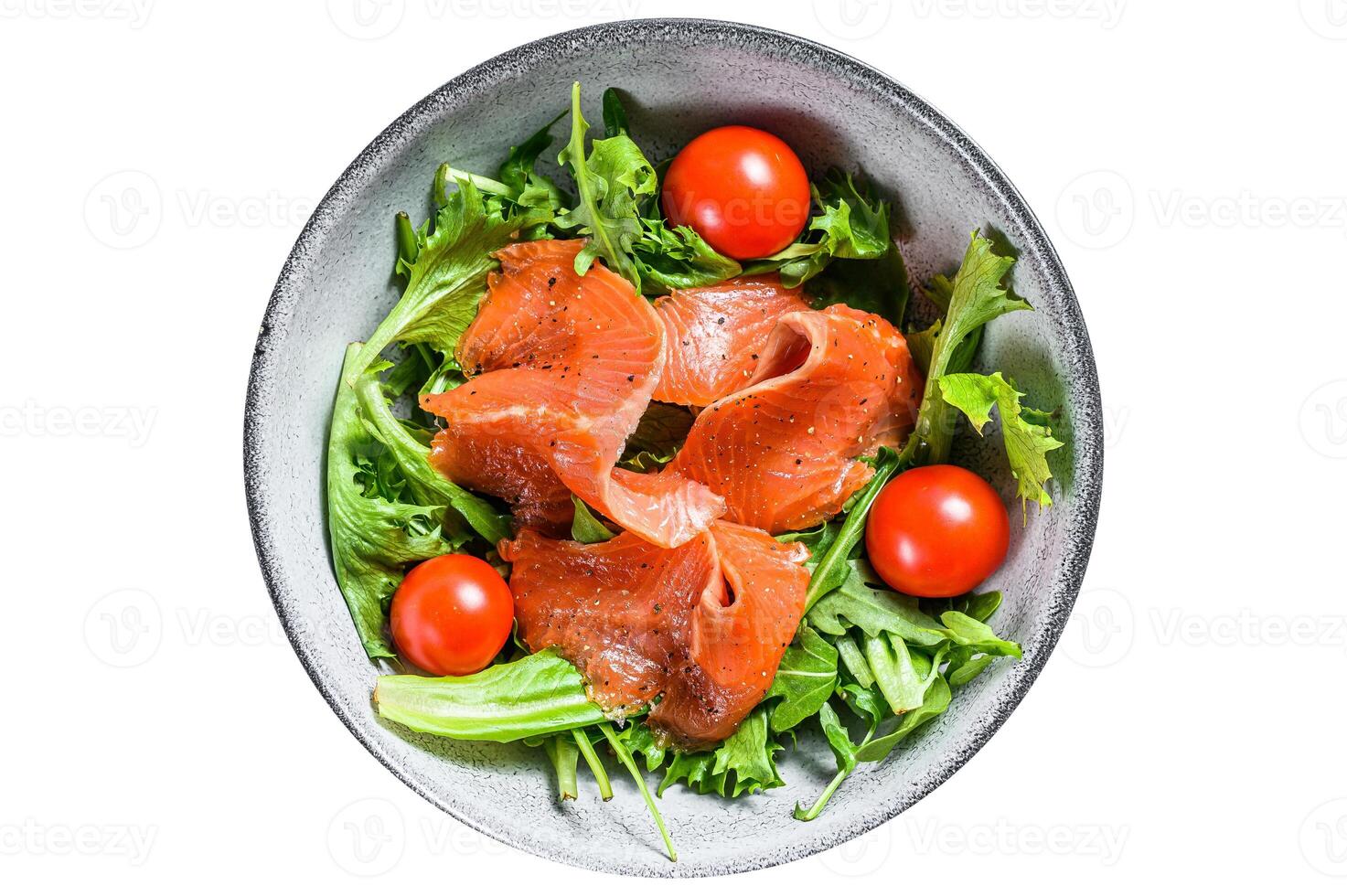 Salad with smoked salmon, arugula, avocado and cherry tomatoes. Concept for a tasty and healthy meal. Isolated on white background. photo