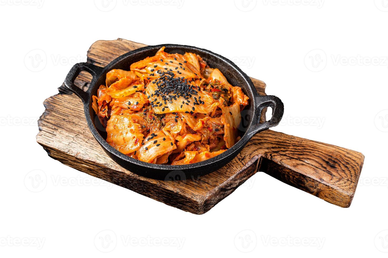 Kimchi salted and fermented chinese cabbage in a skillet. Isolated, white background. photo
