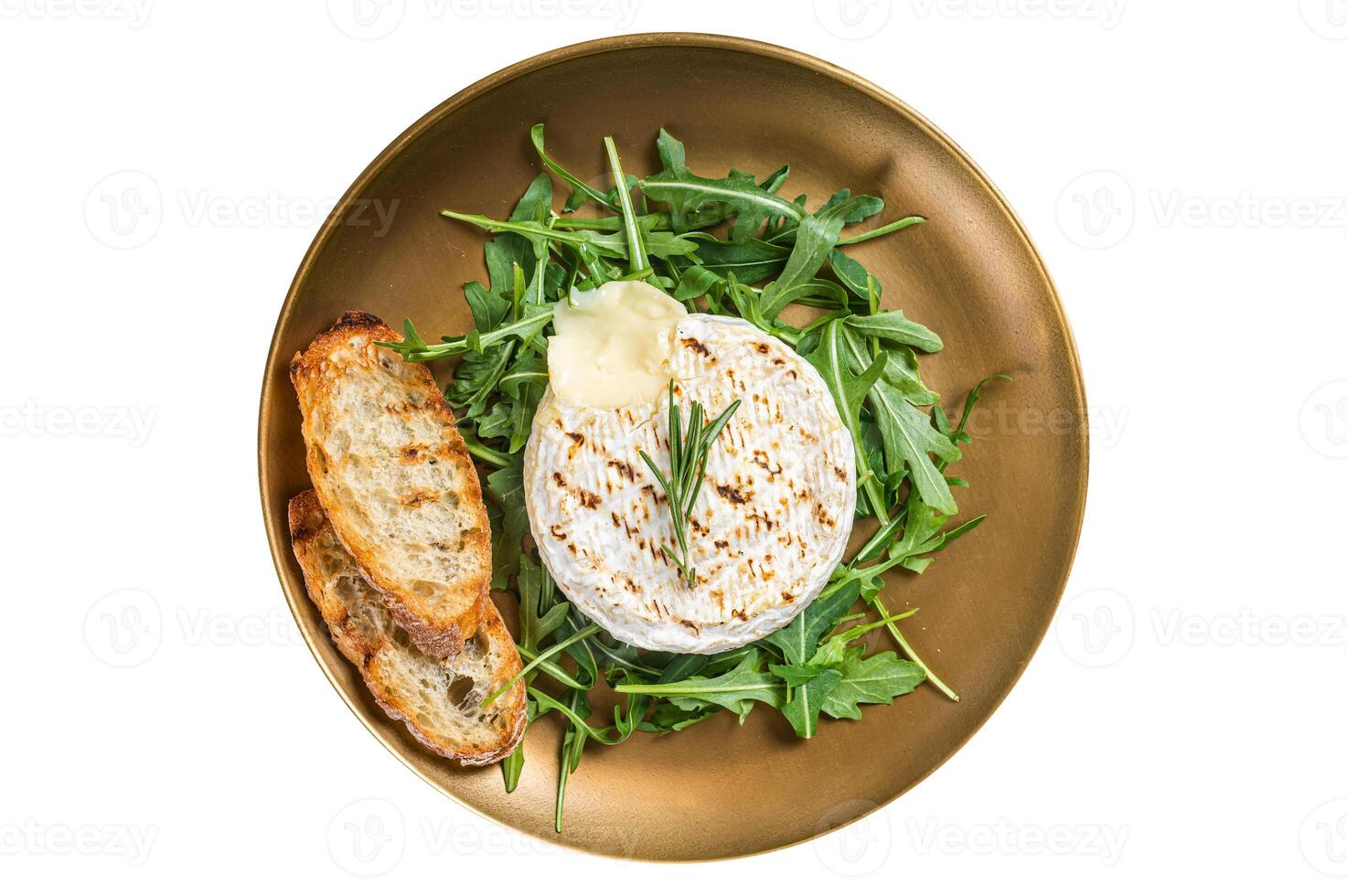 Salad with grilled Camembert cheese, arugula, toast and rosemary in a plate. Isolated on white background. photo