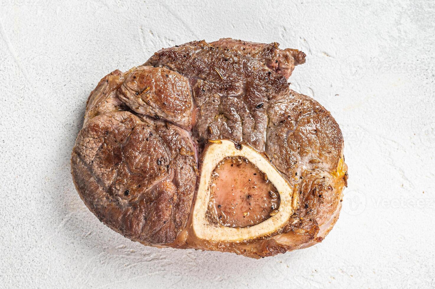 Veal shank Osso Buco, italian ossobuco meat steak. White background. Top view. Copy space photo
