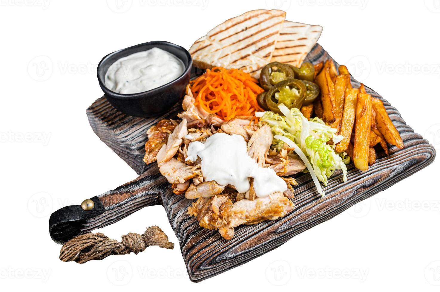 Kebab, Shawarma, Gyro grilled meat with french fries and vegetables on a wooden board. Isolated, white background. photo