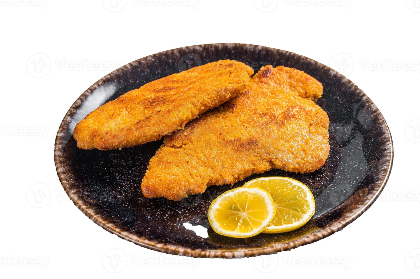 Roasted breaded german weiner schnitzel on a plate. Isolated on white background photo