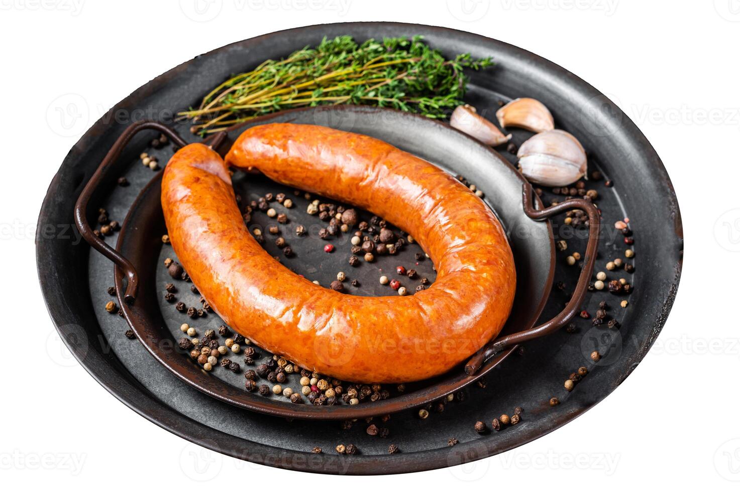 Smoked sausage with thyme and spices in a steel tray. Isolated on white background. Top view. photo