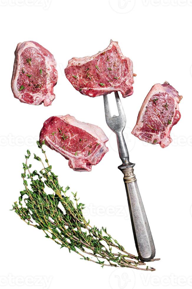 Raw lamb loin steaks, chops cutlets Isolated on white background, top view. photo