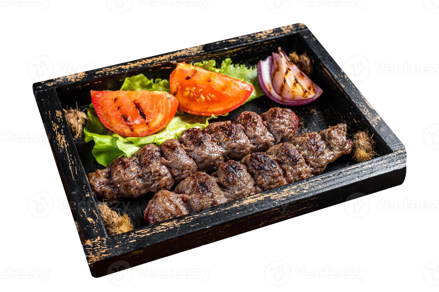 Traditional middle east kefta or kofta kebab, ground beef and lamb meat grilled on skewers served with tomato, salad and onion. Isolated on white background. Top view. photo