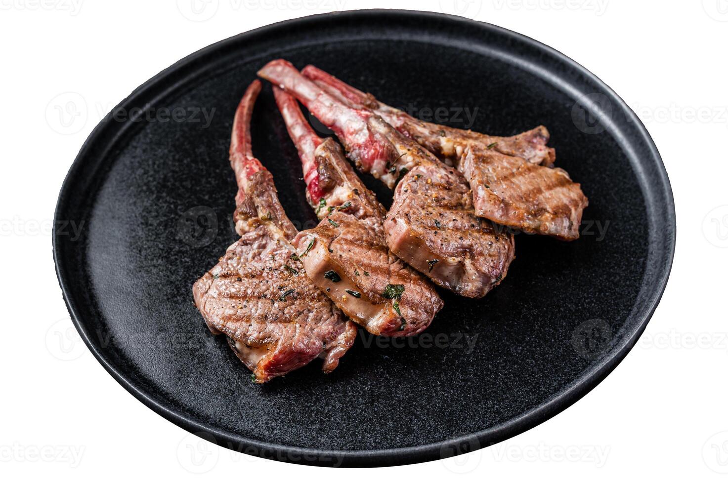BBQ Grilled lamb chops steaks in a plate. Isolated on white background, top view. photo
