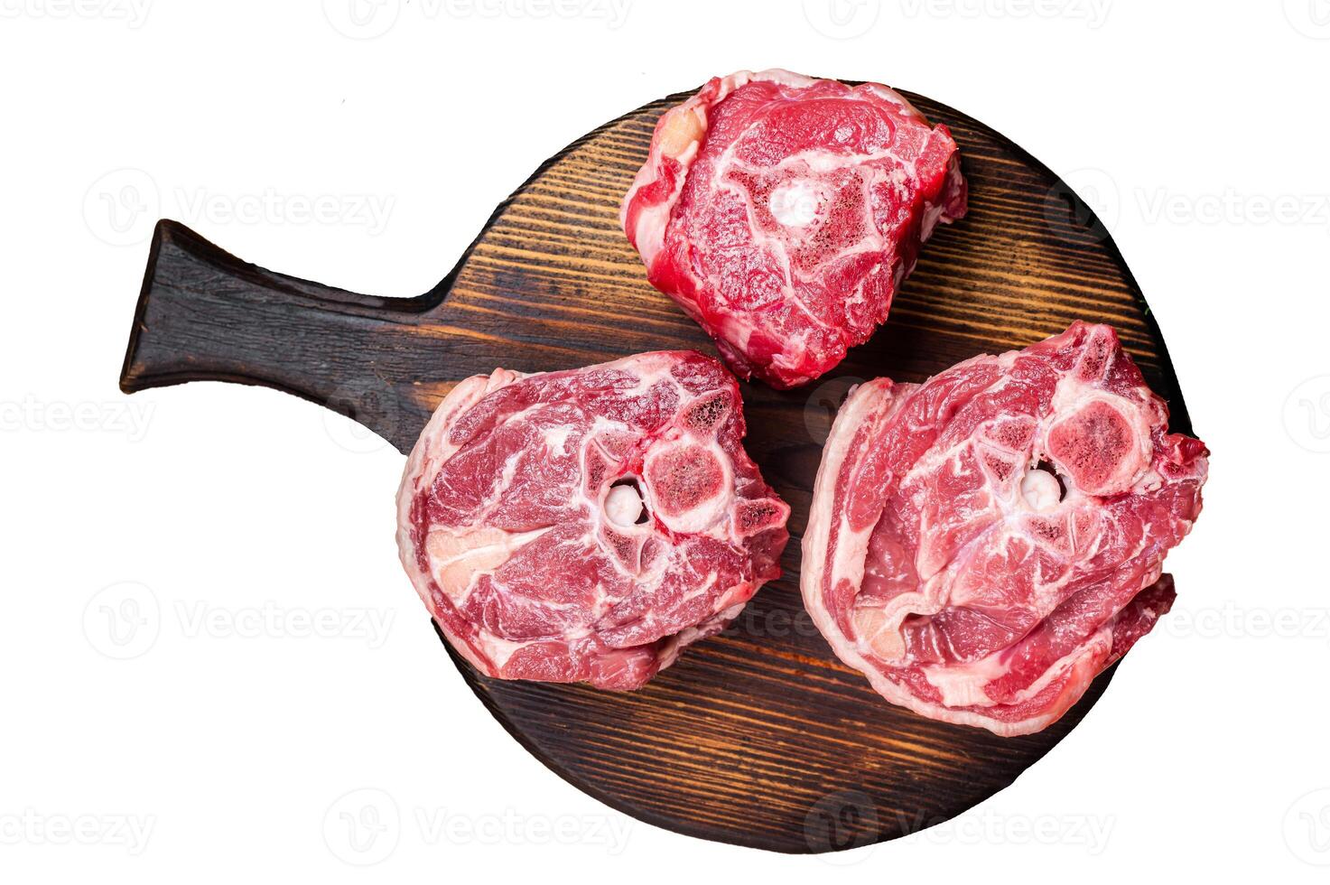 Raw lamb neck chops, fresh mutton meat on a butcher board with herbs. Isolated, white background. photo