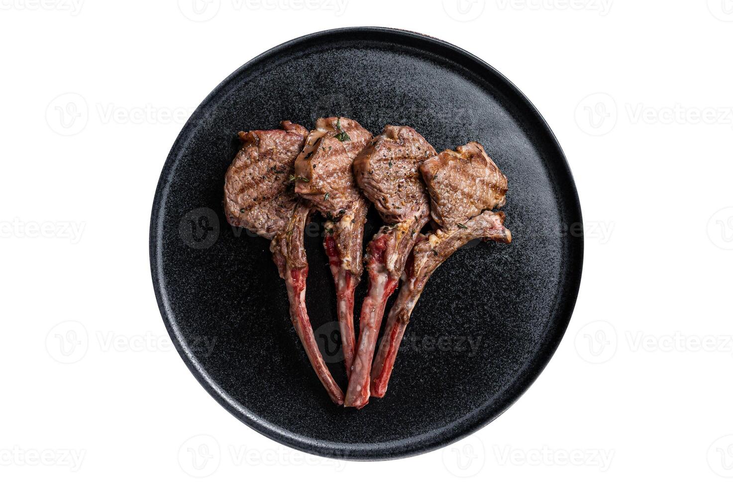 BBQ Grilled lamb chops steaks in a plate. Isolated on white background. photo
