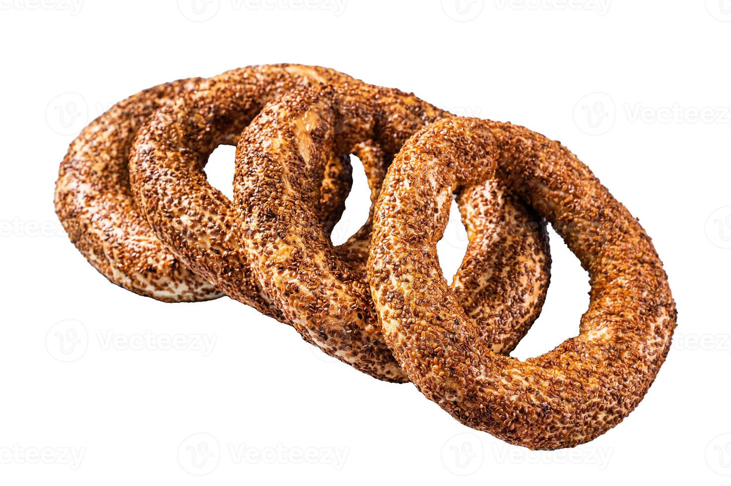 Turkish Bagel Simit with sesame traditional pastry. Isolated on white background, top view. photo